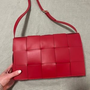 Woven red leather bag